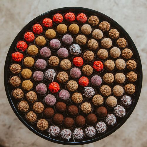 Bourbon ball party trays are availabe in small, medium and large sizes.  Made with a variety of all our current bourbon ball offerings.  Customizable.  Local, Kansas City pick-up only.  This cannot be shipped.  Bourbon Chocolate.  Party trays.  Bootleg Bourbon Balls