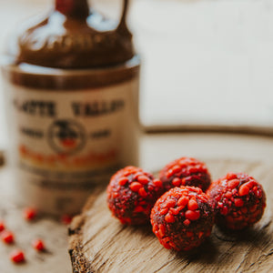 Platte Valley Fireshine corn whiskey and cinnamon liqueur blended with 72% dark chocolate and toasted pecans, then rolled in crushed cinnamon imperials.  A nostalgic "Red Hot" treat that will leave cinnamon lovers wanting more.  Kansas City gifts.  Bourbon chocolate.