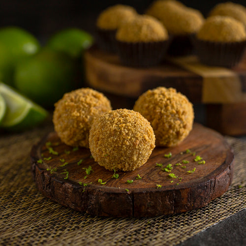 Handcrafted with European white chocolate, roasted Macadamia nuts, key lime juice, KeKe Key Lime Pie Liqueur, rolled in a graham cracker crumble topping.  Transporting you to the Keys one delcious bite at a time.